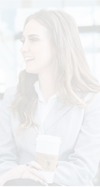 business woman seated with coffee