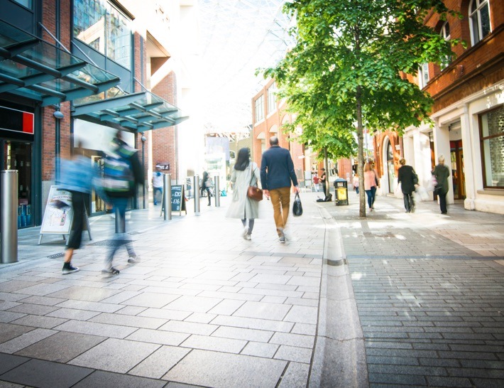 people on walkway outside commercial shopping complex