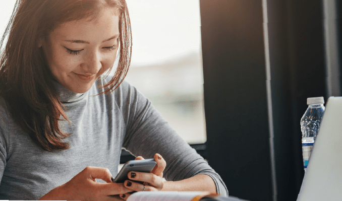 woman student on mobile device