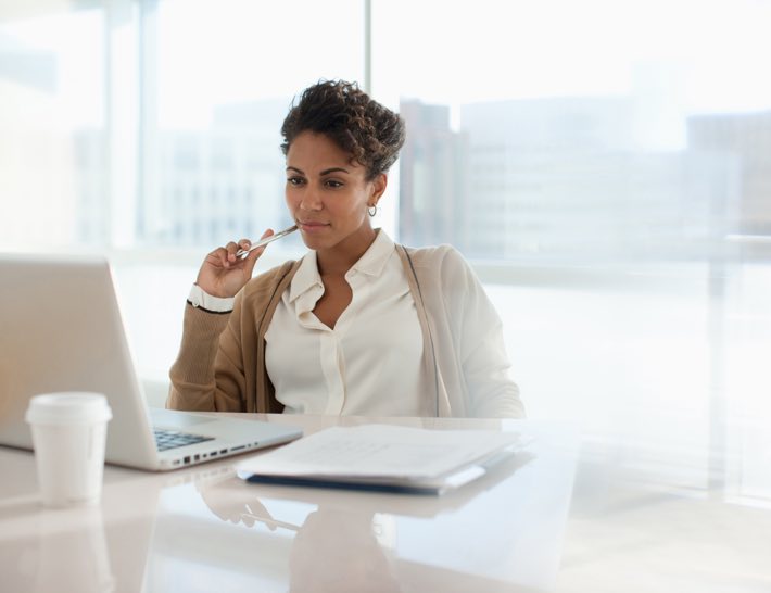 woman looking at laptop